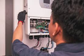 Technician servicing an inverter